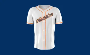 A white baseball jersey with orange trim and 