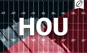 An American football field with red and blue halves, marked with yard lines and numbers.