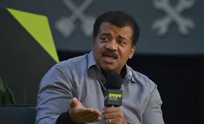 Neil deGrasse Tyson speaks into a 