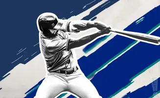 A baseball player in a black and white uniform swings a bat.