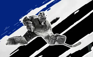 A hockey goalie in a split save stance, with a blue, black, and white abstract background.