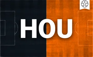 a houston dynamo fc goalkeeper soccer player diving to make a save