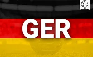 A globe overlaid with the German flag on a grassy field, with a soccer ball icon in the top right.