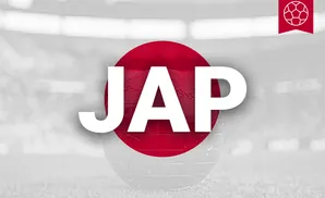 A globe with the Japanese flag overlayed, set against a blurred stadium background.