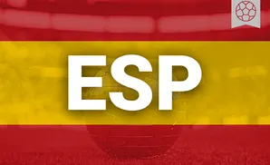 A globe with a football icon on a Spanish flag background.