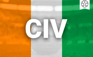 A glass globe rests on grass, overlaid with the orange, white, and green stripes of the Ivorian flag and a soccer ball icon.