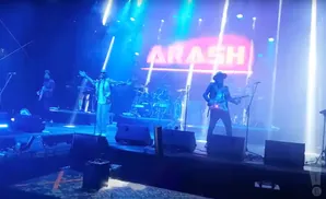 A band performs on stage with the name 