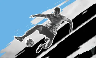A soccer player leaps to kick a ball against a backdrop of diagonal black and white stripes and a blue sky.