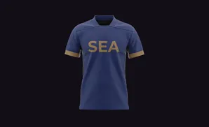 A blue t-shirt with gold trim and the word 