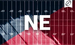 American football field split in red and blue, marked with yard lines and numbers, with a football icon in the upper right corner.