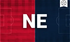 a new england revolution goalkeeper soccer player diving to make a save