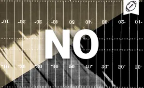 An overhead view of a football field with yard lines and numbers.