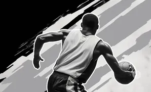 A basketball player dribbles the ball with a graphic background.
