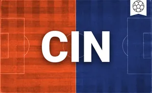 a fc cincinnati soccer player kicking the ball down field