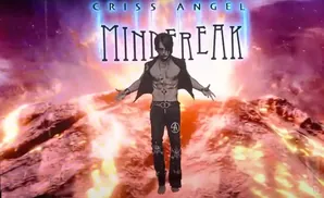 Criss Angel, shirtless and in black pants, stands with arms outstretched in front of a 