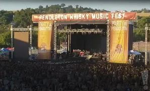 A large outdoor music festival stage with 