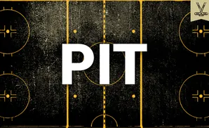 Aerial view of a hockey rink with yellow lines and markings on a black, textured background.