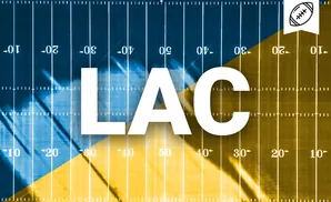 A football field split diagonally in blue and gold. White yard lines and numbers are visible.