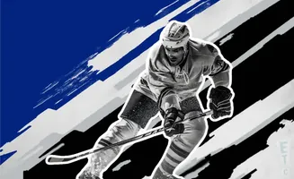 Hockey player in action, with stylized blue, black, and white background graphics.