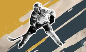 A black and white image of a hockey player in uniform, holding a stick and skating.