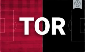 a toronto fc goalkeeper soccer player diving to make a save