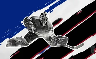 Hockey goalie in black and white, diving to make a save. Background has bold red, white, and blue diagonal stripes.