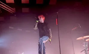 waterparks lead singer singing in front of fog