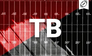 Football field with red and black halves, marked with yard lines and numbers.