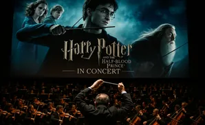 Harry Potter and the Half-Blood Prince in Concert with a conductor leading an orchestra.