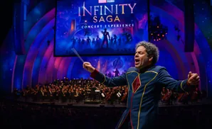 Conductor leads orchestra during a Marvel 