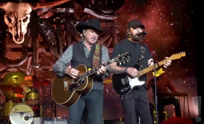 brooks and dunn performing side by side on stage