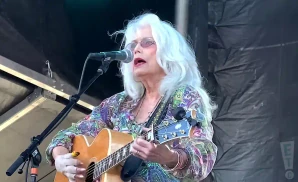 emmylou harris singing and playing guitar on stage