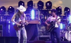 two flatland cavalry members playing on stage together