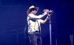 jimmie allen singin live in a gold jacket and shades