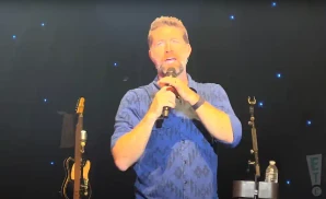 josh turner performing on stage with band behind him