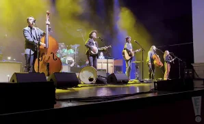 the avett brothers performing on stage shot of entire band