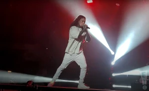 a rear view picture of ronnie radke from falling in reverse performing on stage