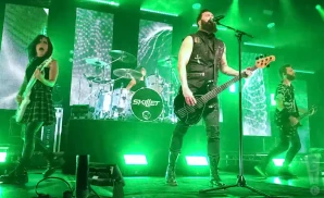 skillet performing on stage at the manchester academy in manchester england