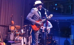keb mo playing the electric guitar and singing live on stage