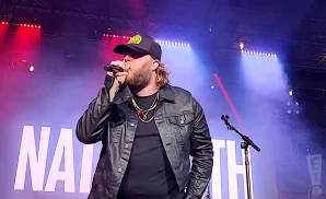 nate smith performing on stage wearing leather jacket