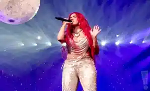 a picture of colombian artist karol g performing on stage at the well fargo center in philadelphia, pensilvania