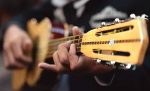 photograph of las cafeteras performing live on stage at an exciting banda style concert event