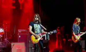 ace frehley performing on stage at the robins theatre in warren, ohio.