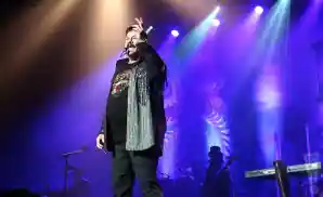 kc and the sunshine band performing on stage at the township auditorium in columbia, south carolina.