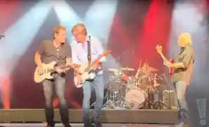 three little river band members jamming out together.