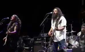 los lonely boys performing on stage in sugar land, texas.