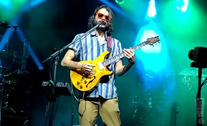 goose performing live on stage shot of singer playing electric guitar