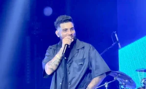 a picture of indian singer karan aujla performing on stage in wembley london