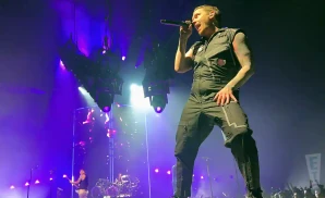 shinedown lead singer performing on stage