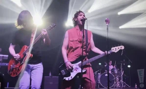 the allamerican rejects singer playing the bass next to electric guitarist